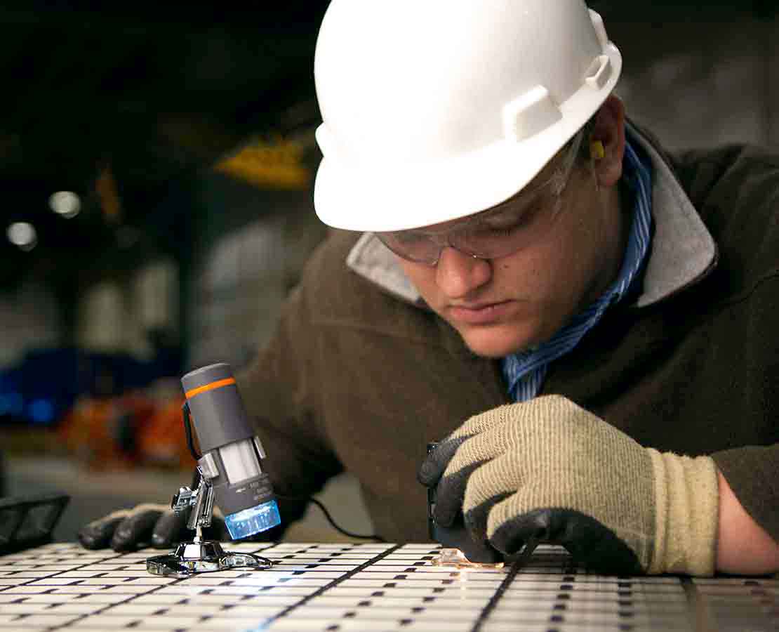 M-I SWACO worker looking at screens.