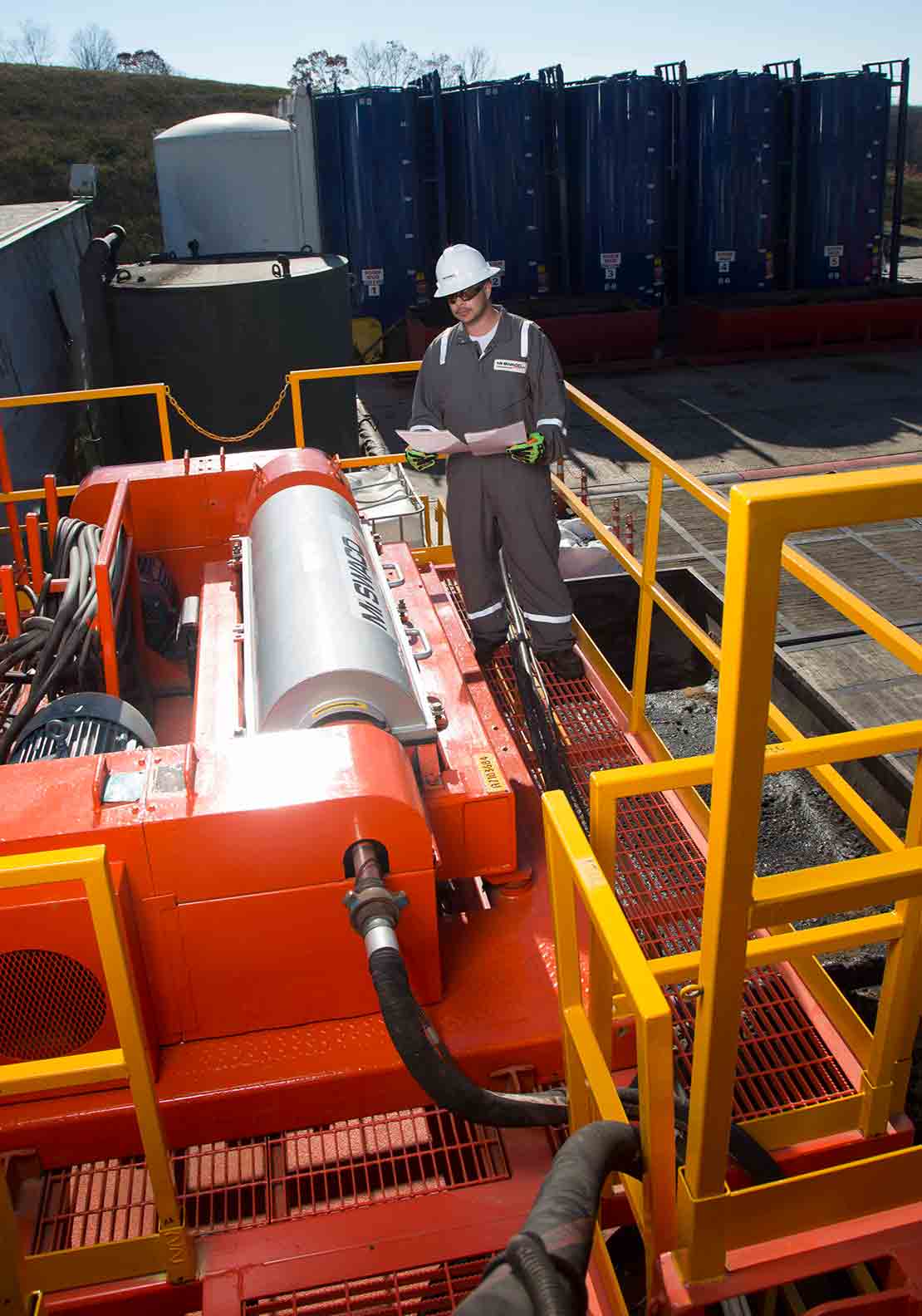 Man Looking at RHE-USE two-stage centrifuge system
