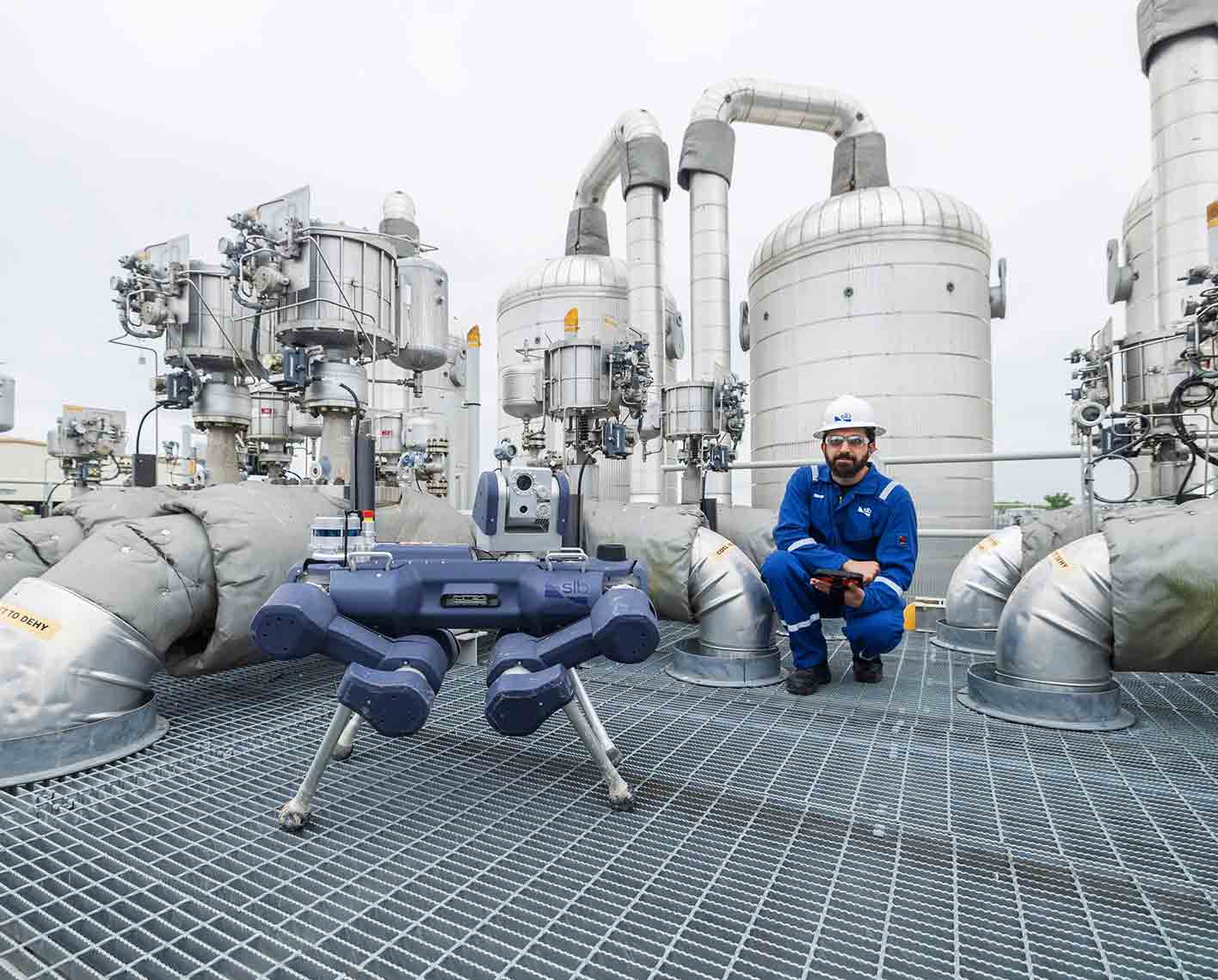 Image of an inspection robot and an operator in an oil and gas process facility.