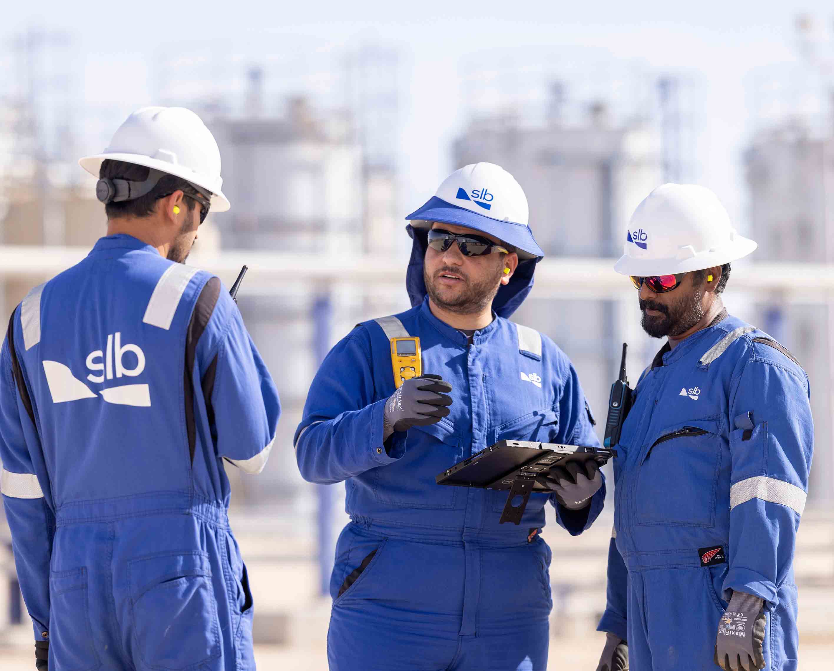 A photo of 3 SLB employees