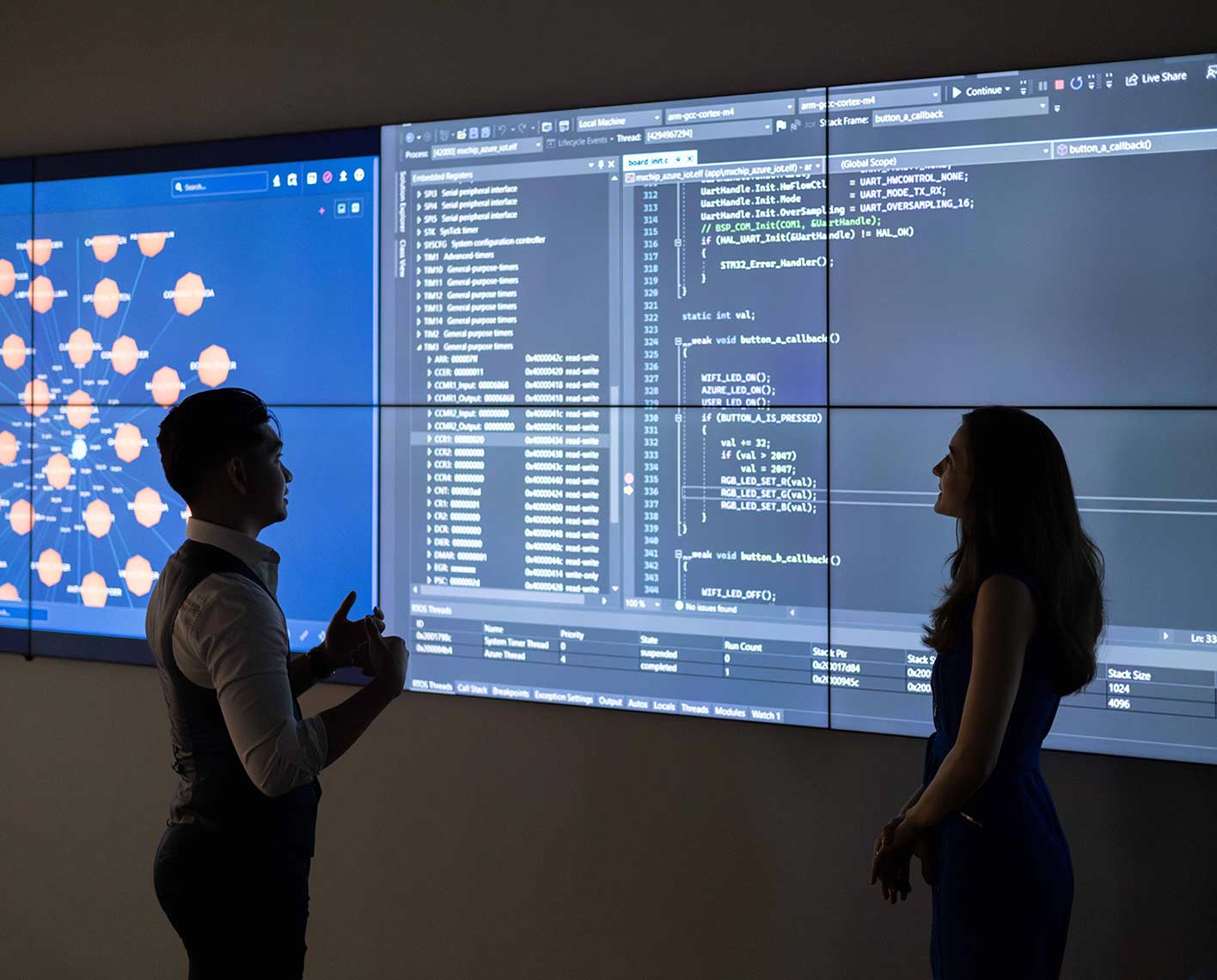 Two people looking at a screen