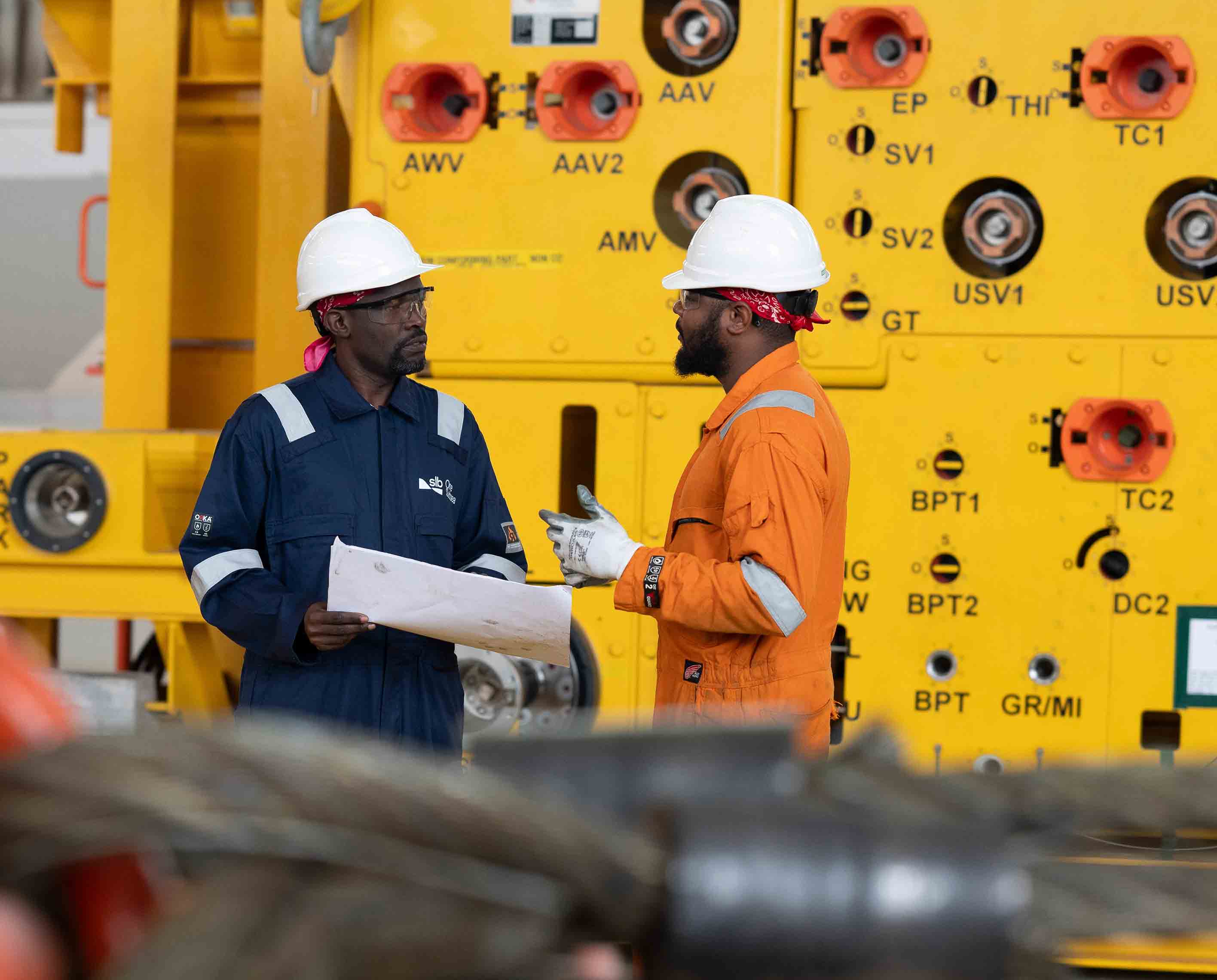 Workers discussing plans