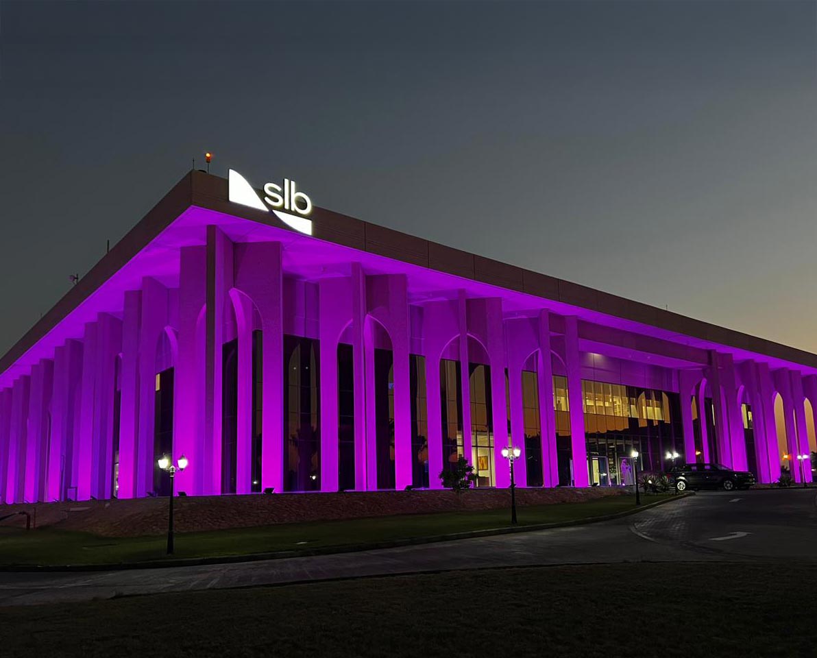 SLB facilities across Africa, Asia, the Americas, Europe and the Middle East lit up vibrant purple — the color symbolizing disability inclusion.