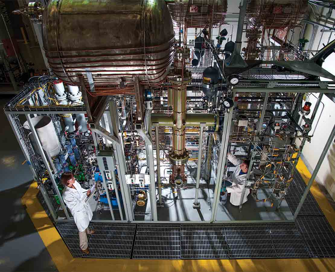 Workers on a sea water treatment module for HESS stampede project