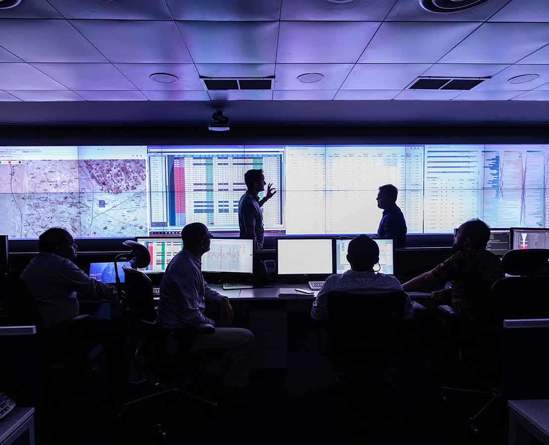 Schlumberger works remotely monitor processing facility data.