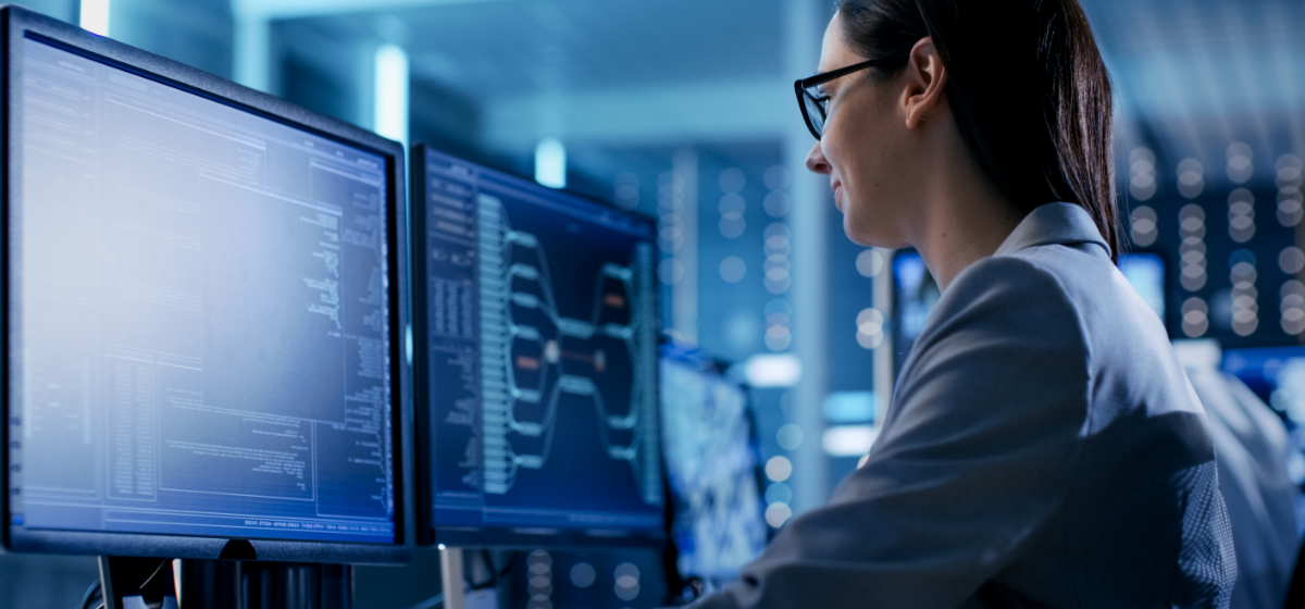 Photograph of a woman at a computer