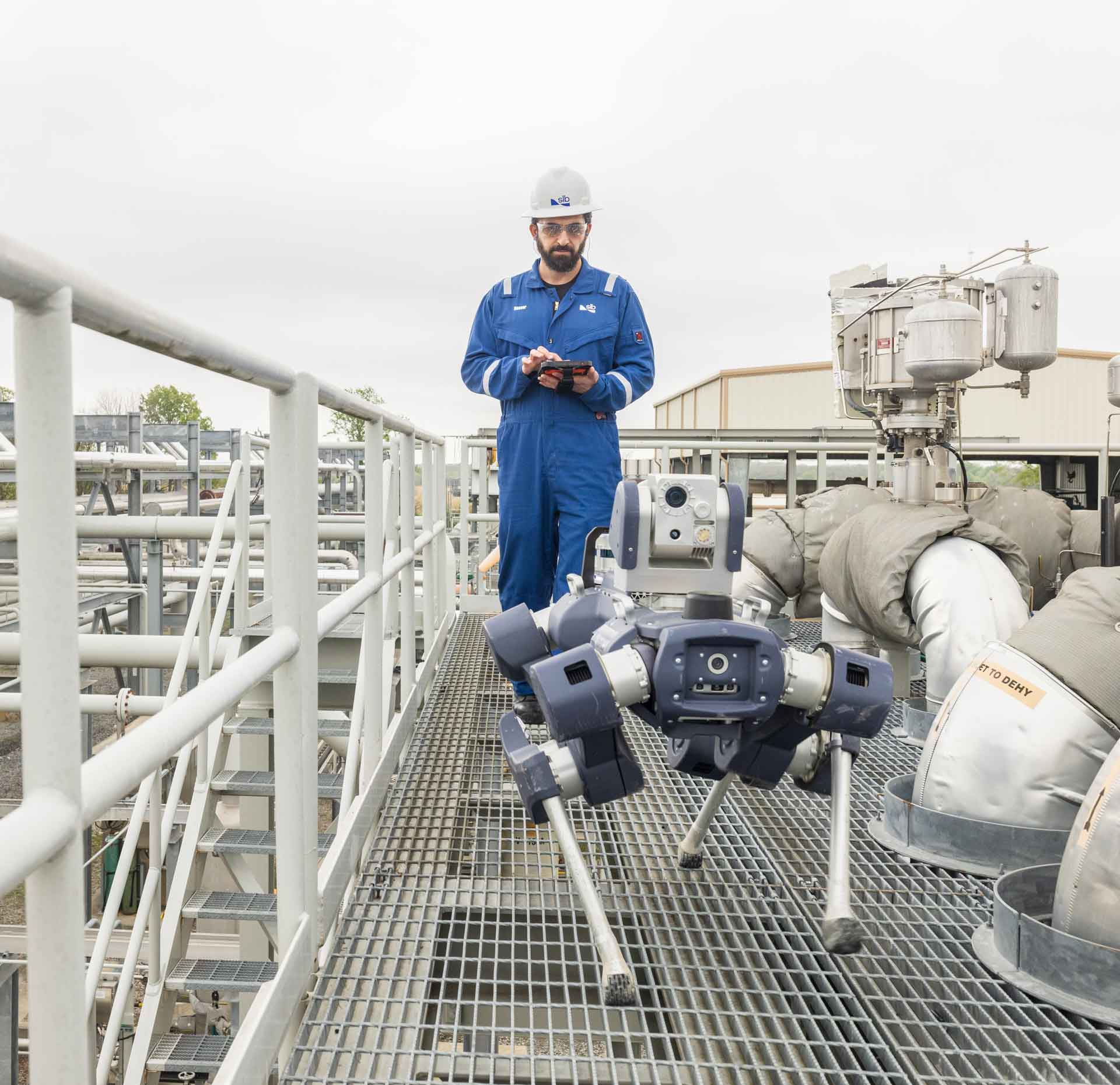 An SLB operator viewing wellsite data on a tablet