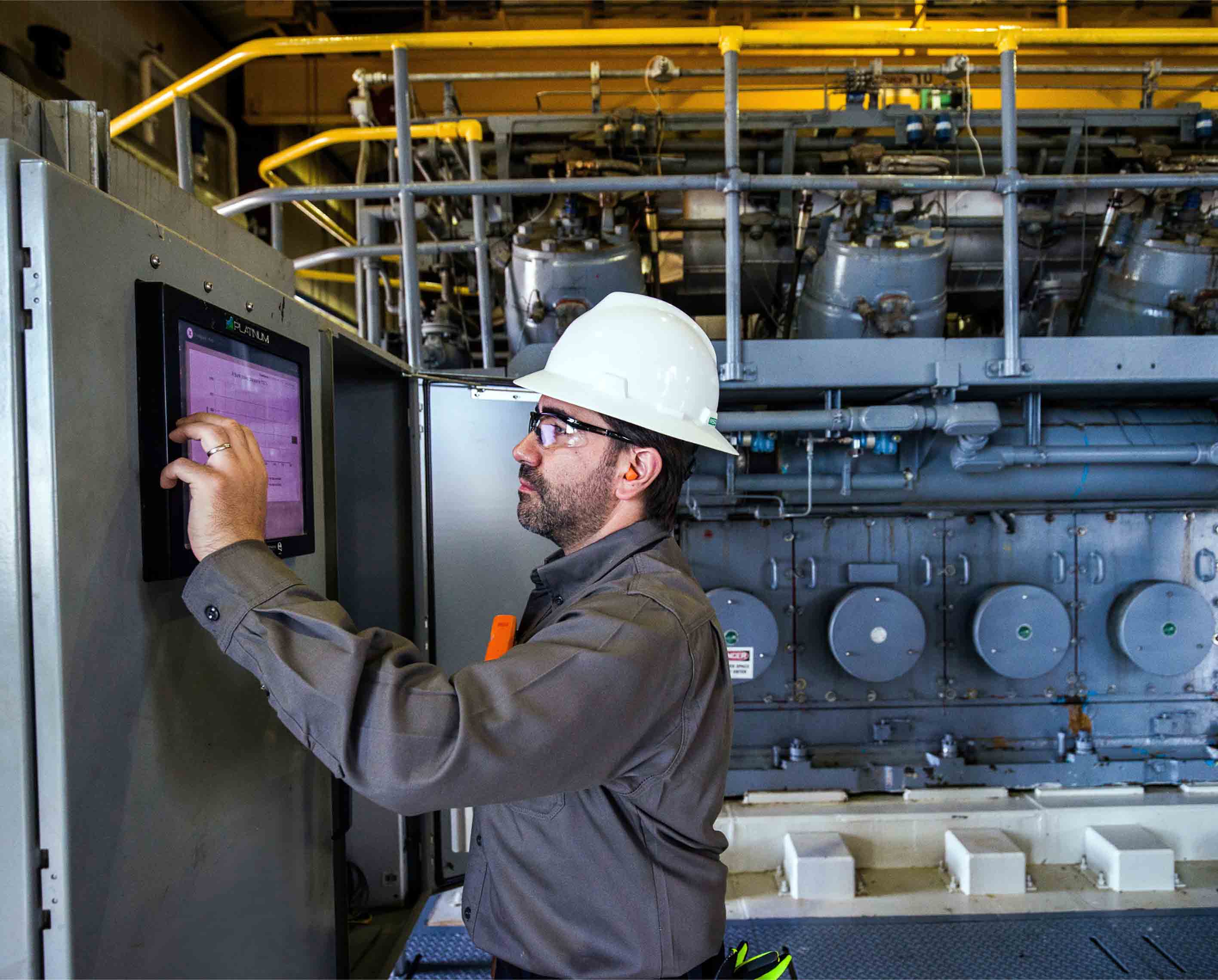 A man operating a software console