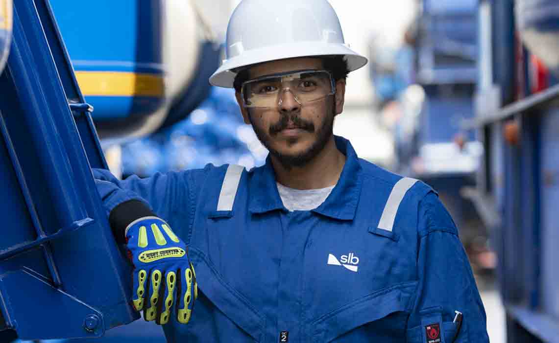 Man faces camera, surrounded by surface testing equipment