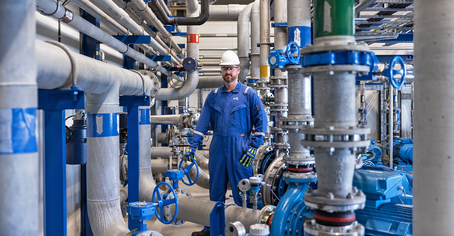 SLB worker in the field looking at equipment.