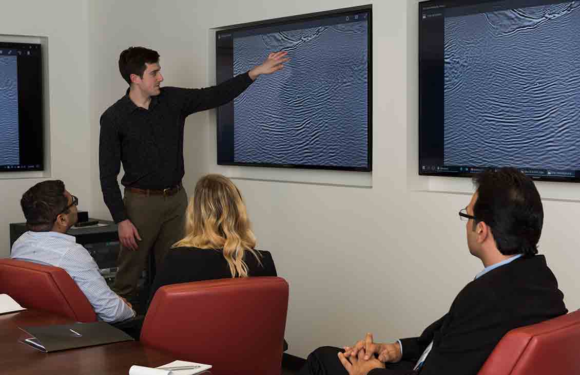 Conference room discussing seismic imaging 