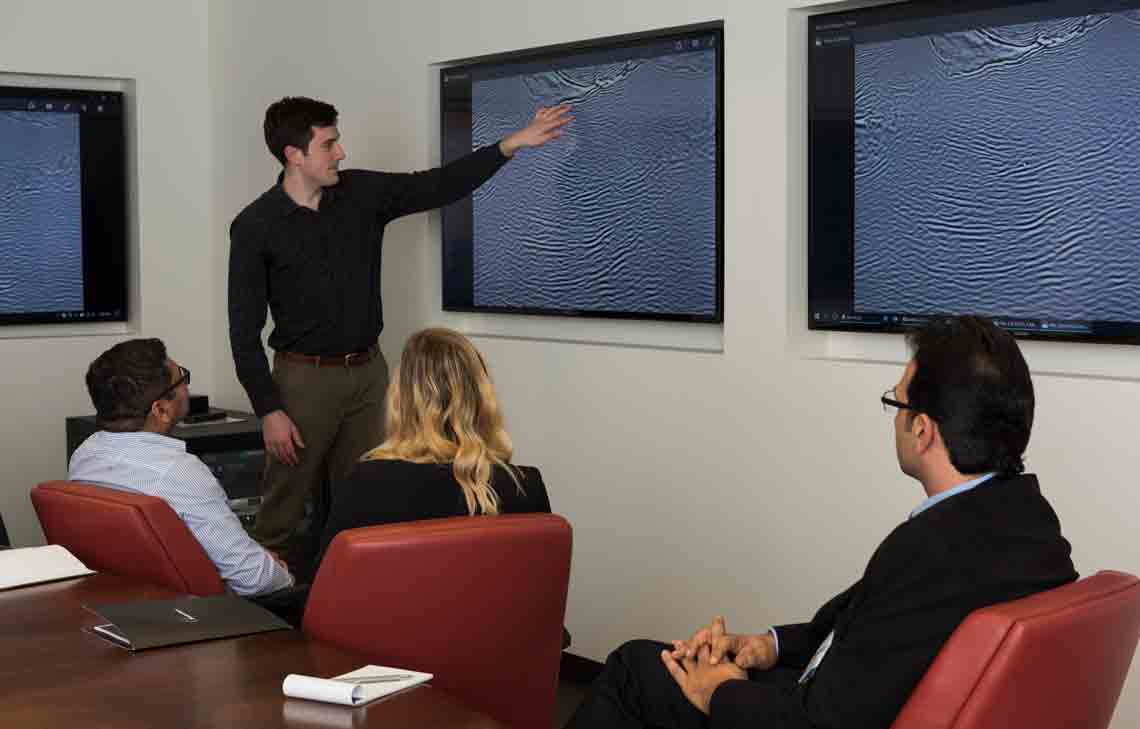 Conference room discussing seismic imaging