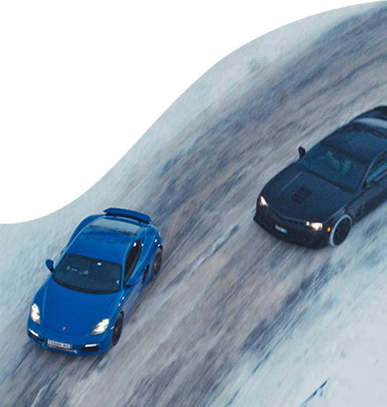 beyond horsepower image of two cars racing on a road