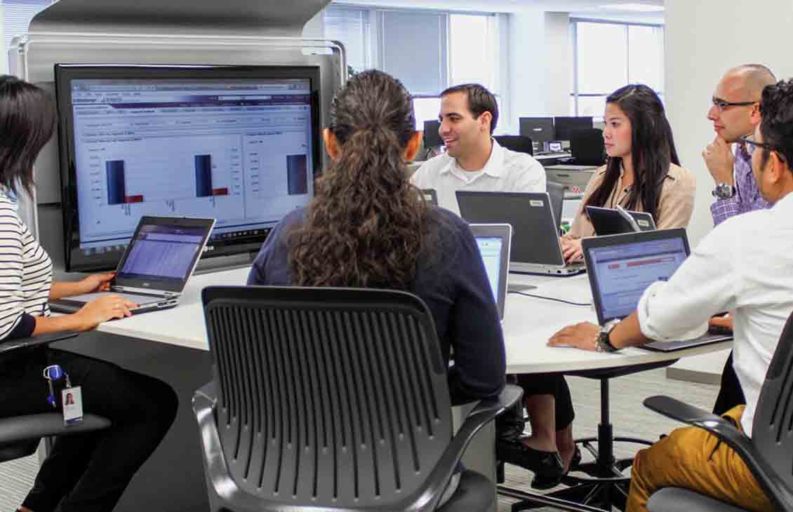 Group reviewing a lesson on a computer screen