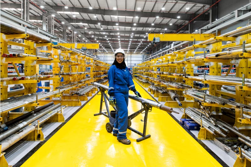 SLB engineer in a manufacturing facility