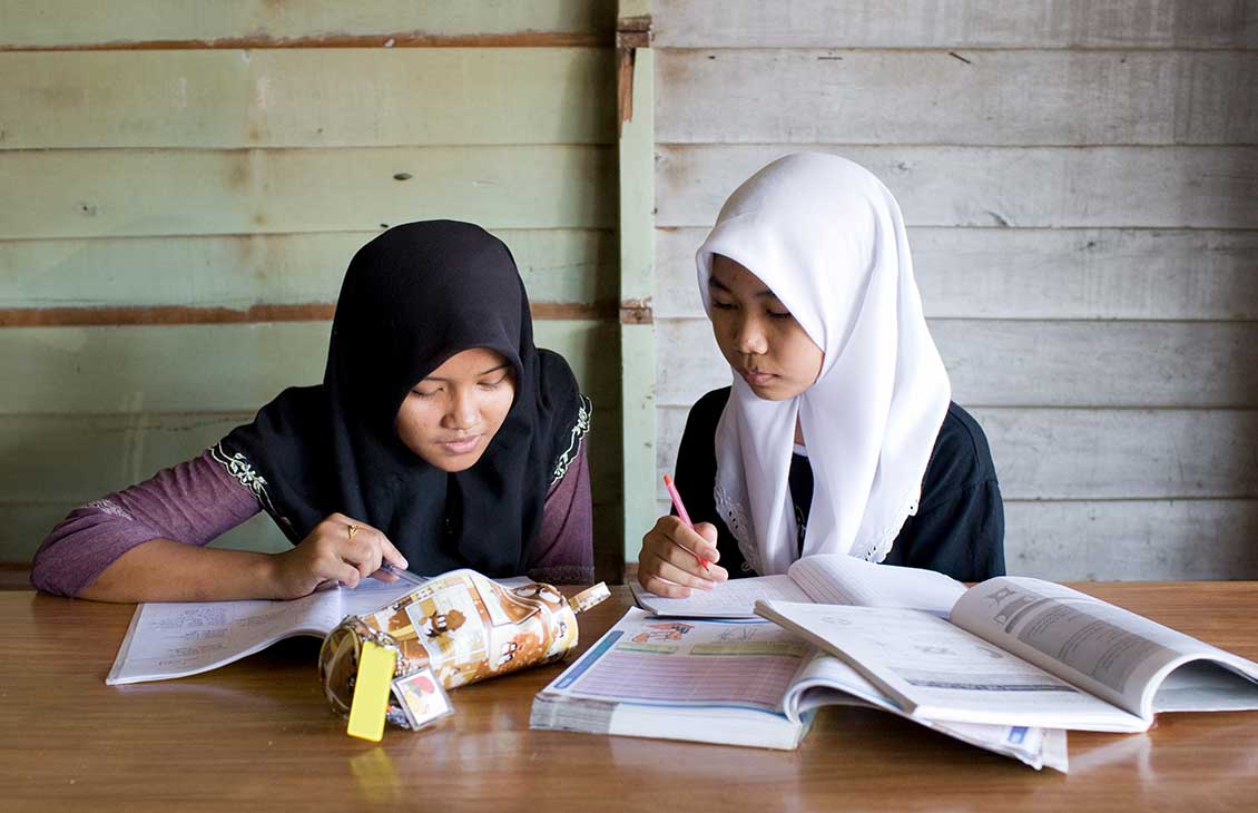 Image of two girls studying together.