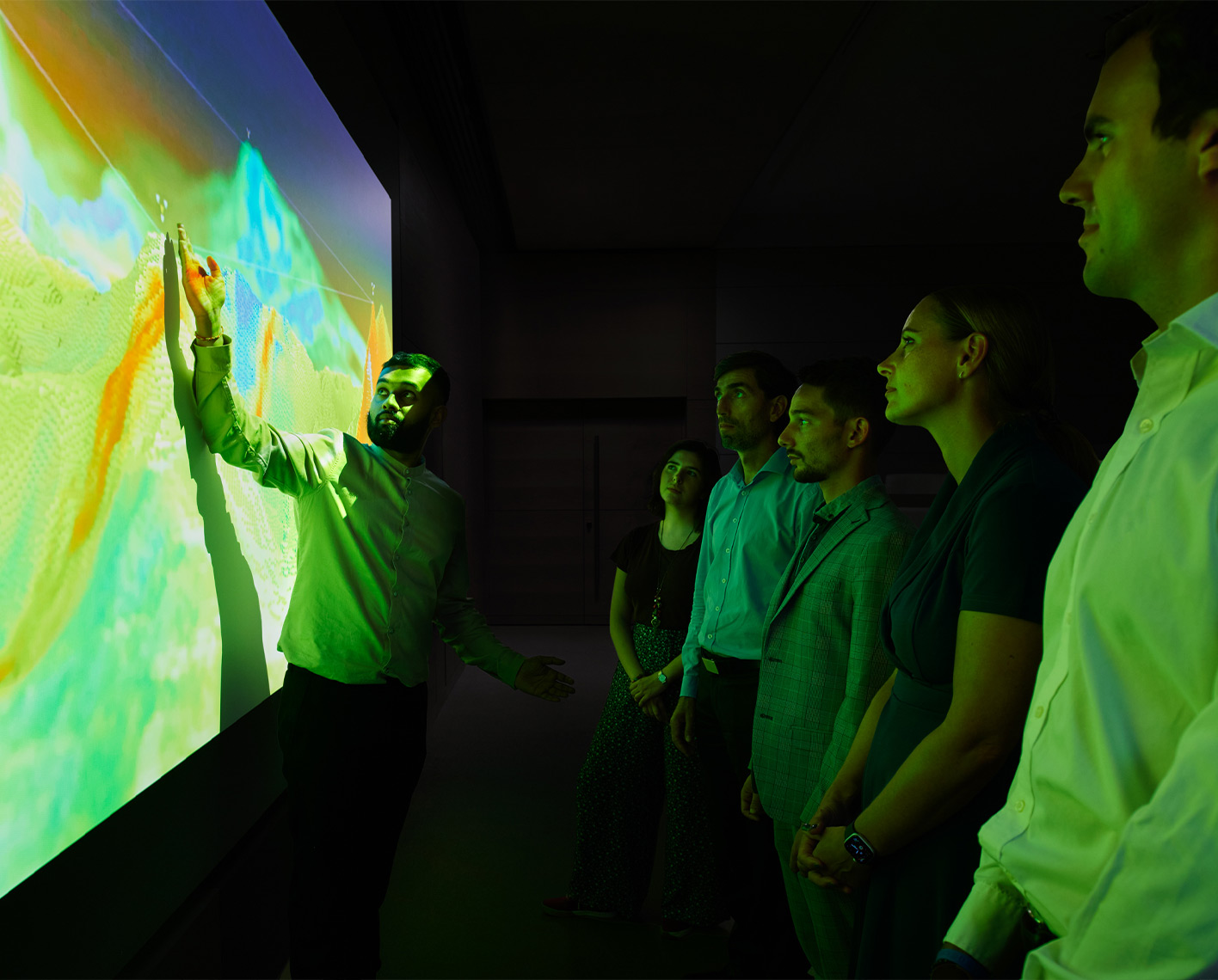 Group of people looking at a projection