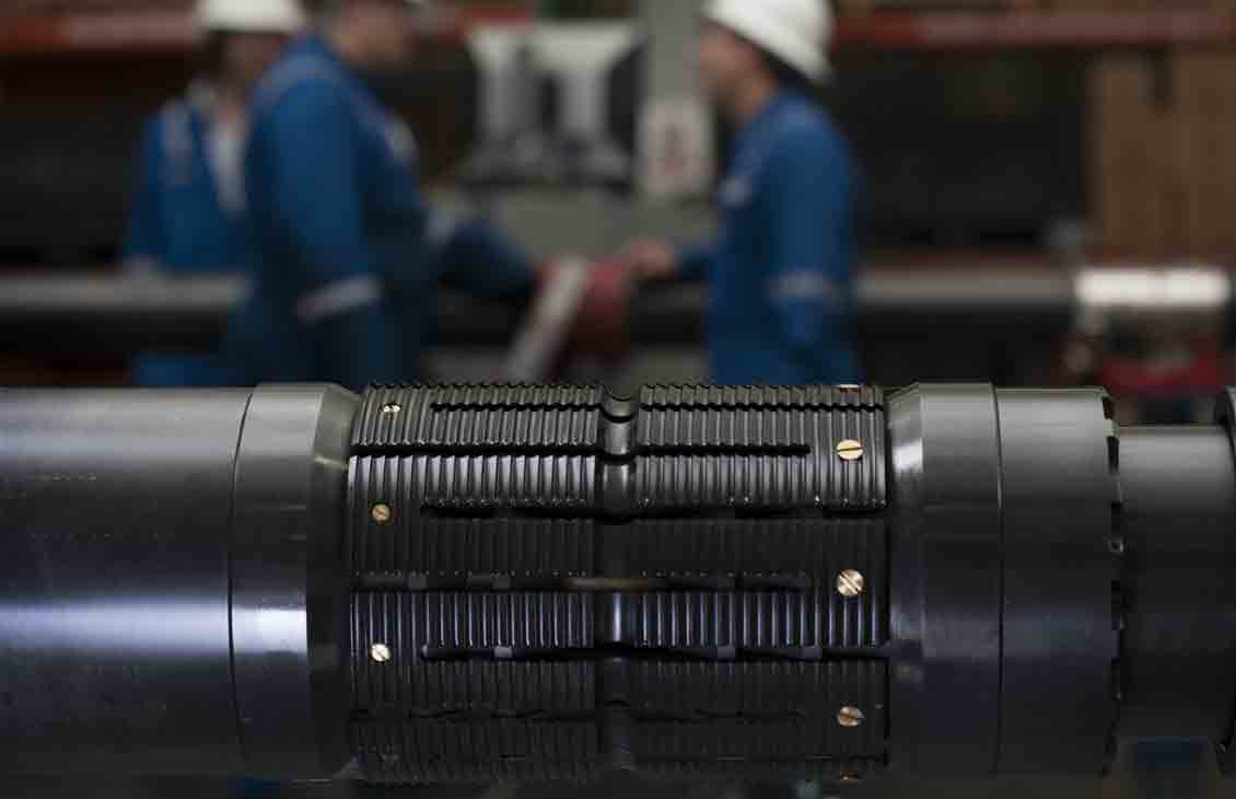 Schlumberger workers in the background and CERTIS high-integrity reservoir test isolation system in the foreground.