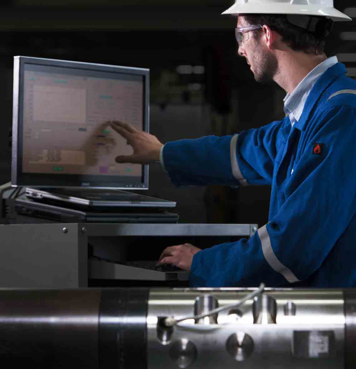 Schlumberger worker performing tests on the IRVD dual valve.