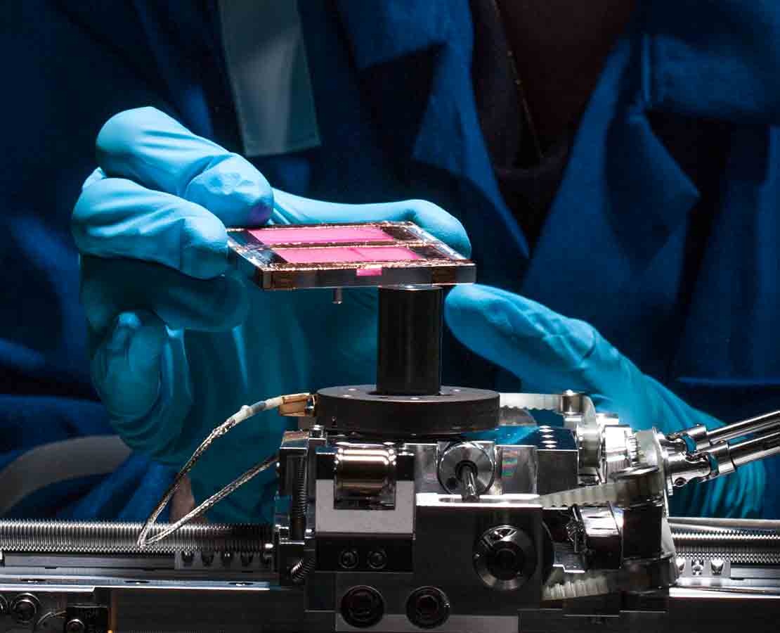 Schlumberger worker in the lab performing EOR lab services.