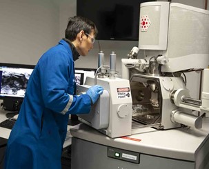 Man analyzing core samples.