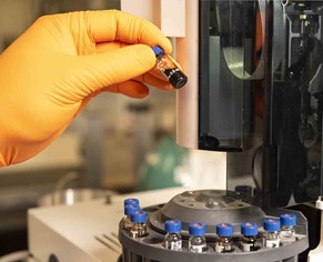 Person analyzing fluid samples.