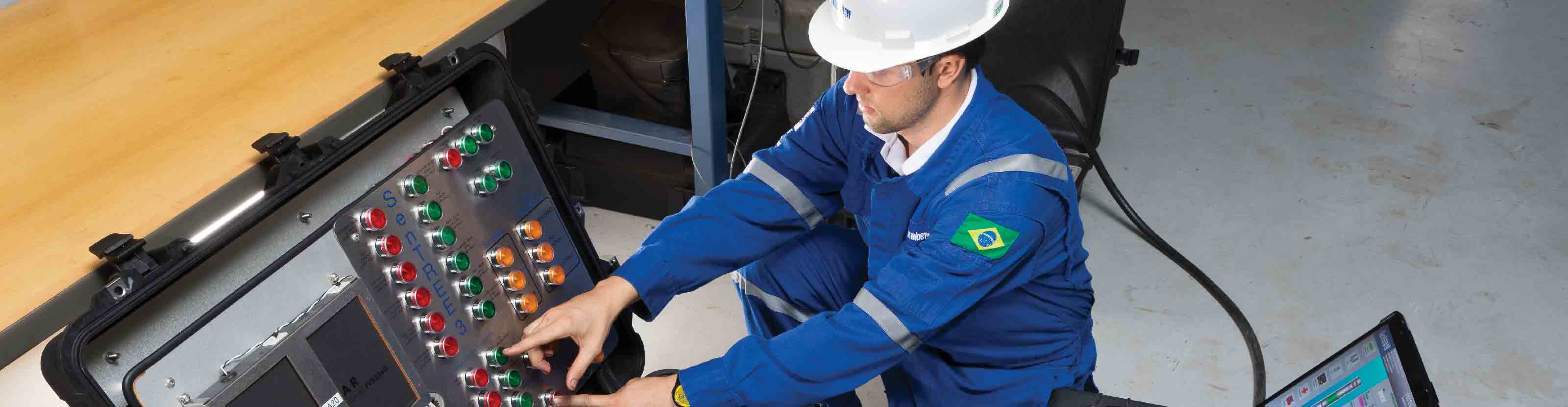 Man pressing a button on the SenTREE 3 console.