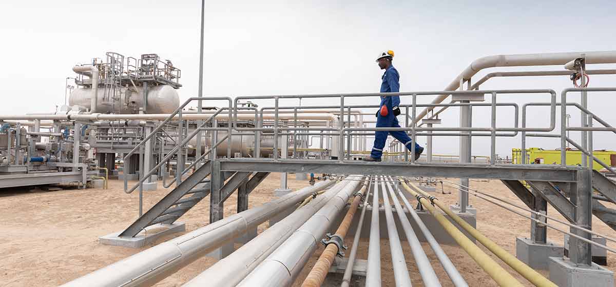 Schlumberger worker processing facility walkway.