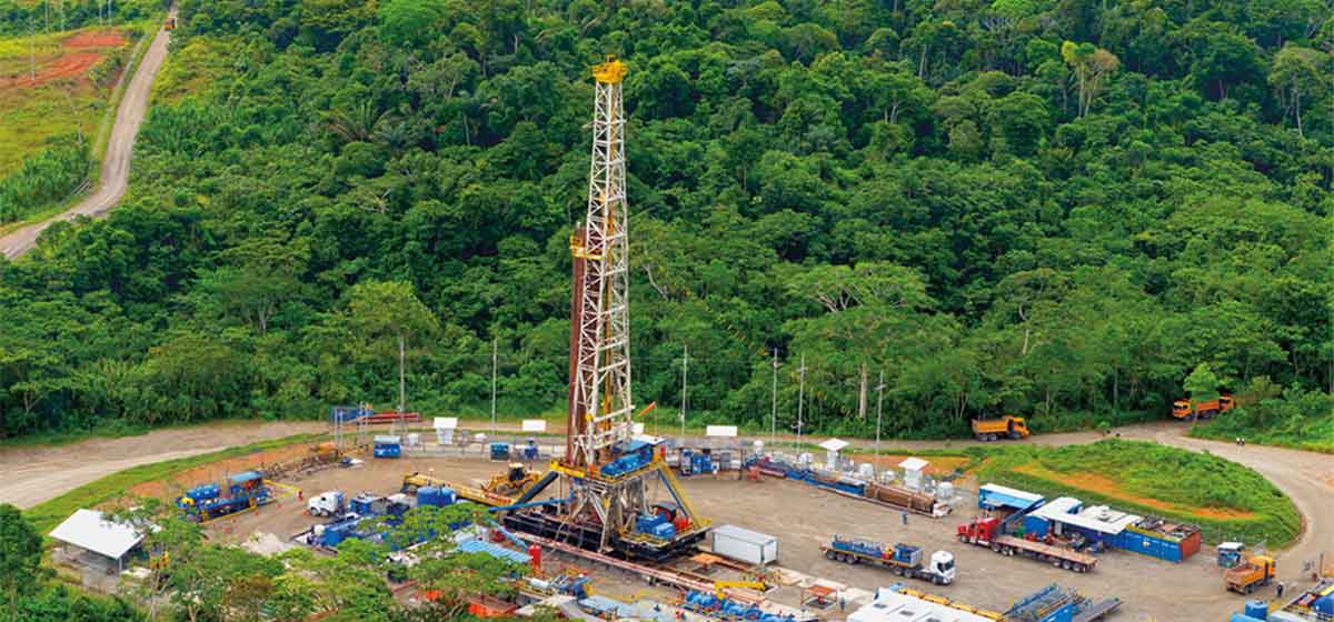 Land rig with green forest in the background. 