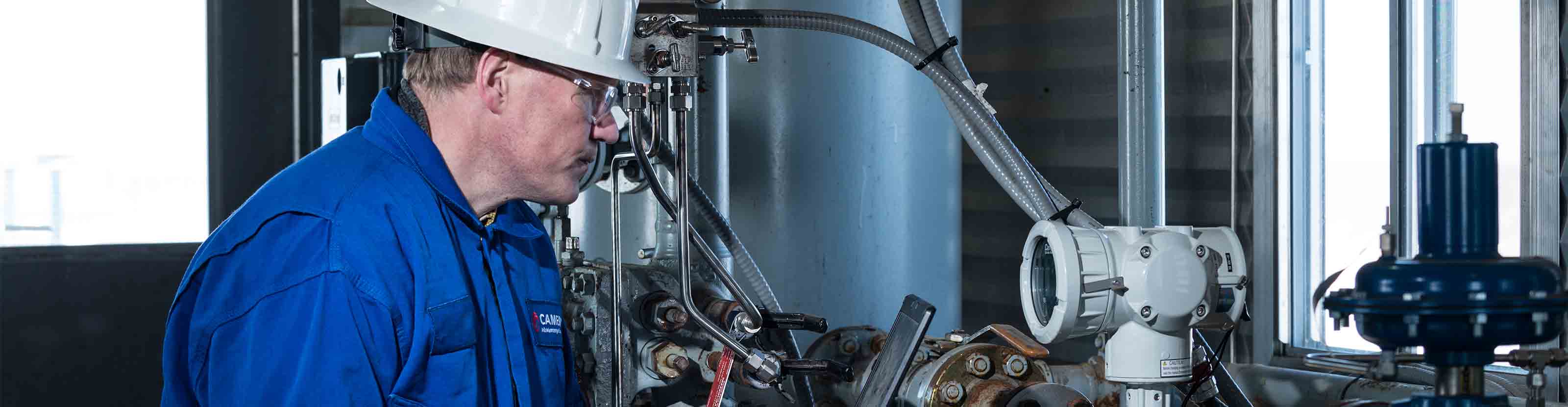 Schlumberger operator checking a measurement device