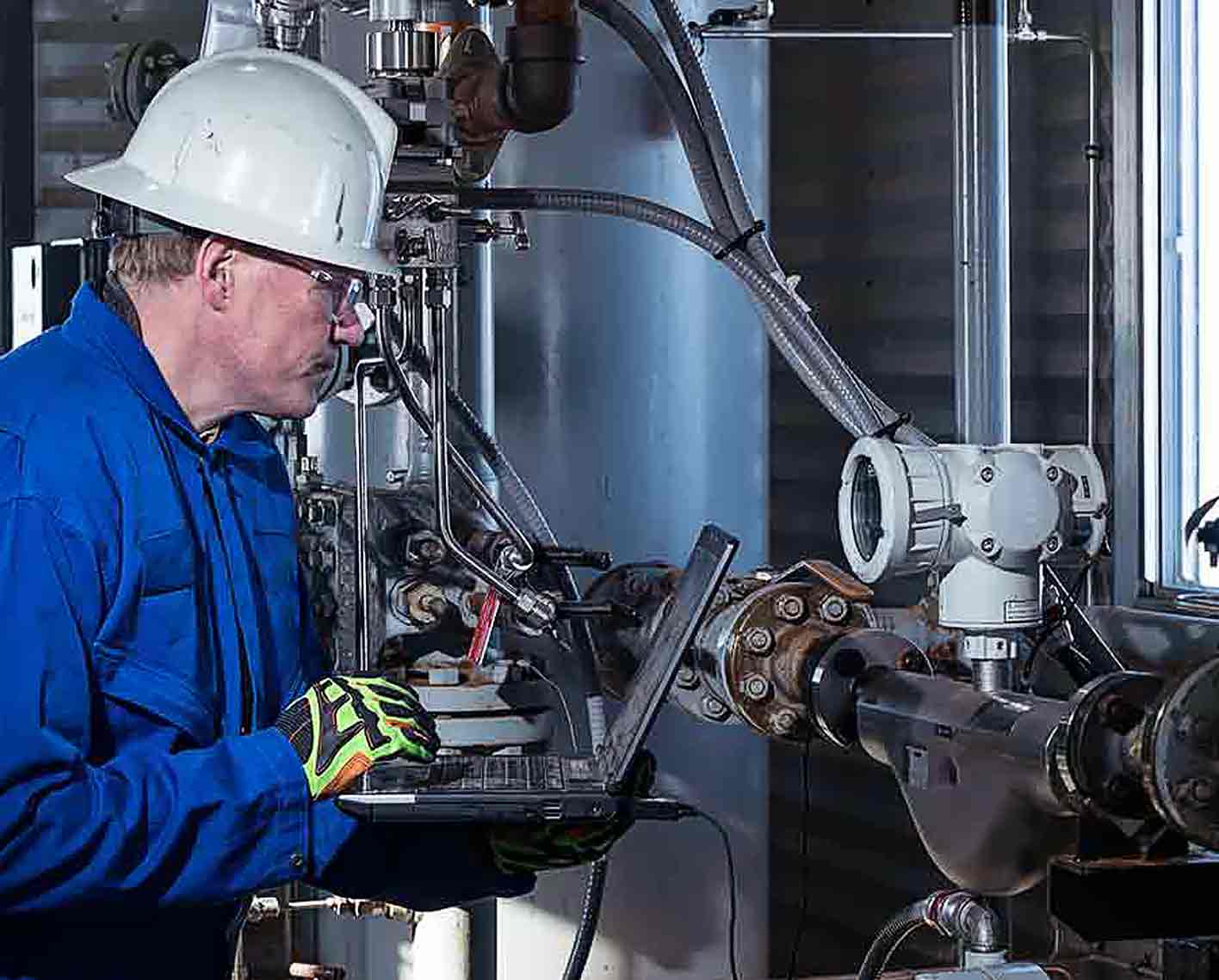 SLB operative recording a measurement in a process plant.