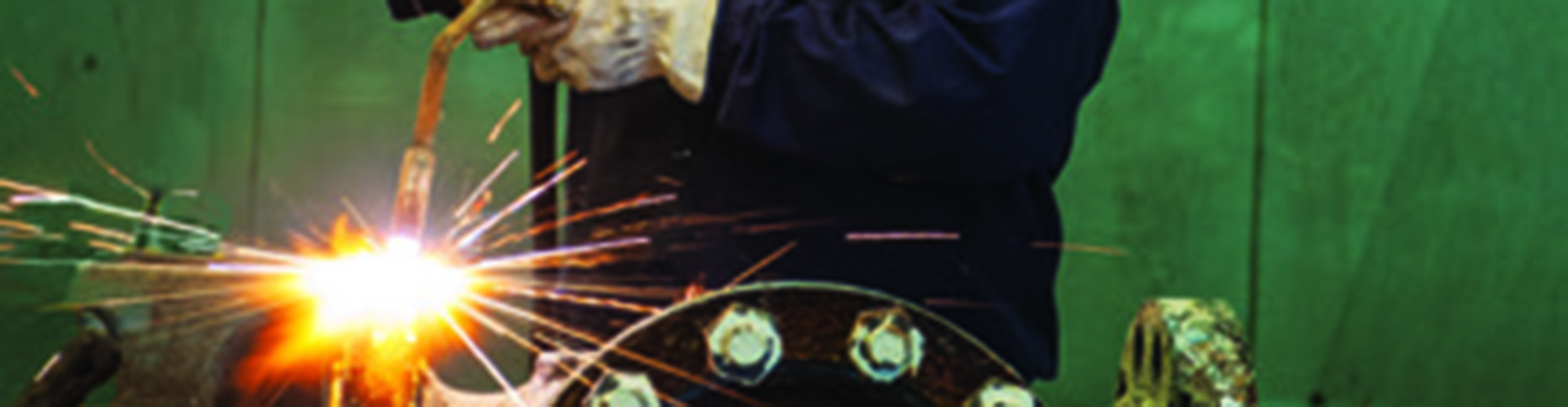 Cameron employee using blow torch on silver valve.