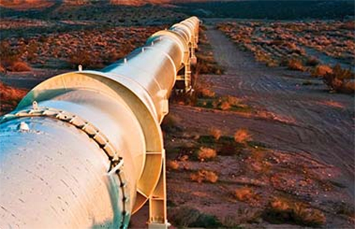 Above-ground pipe in desert location.